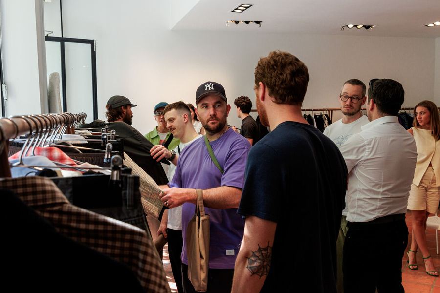 Buyers and brands in conversation among the rails.