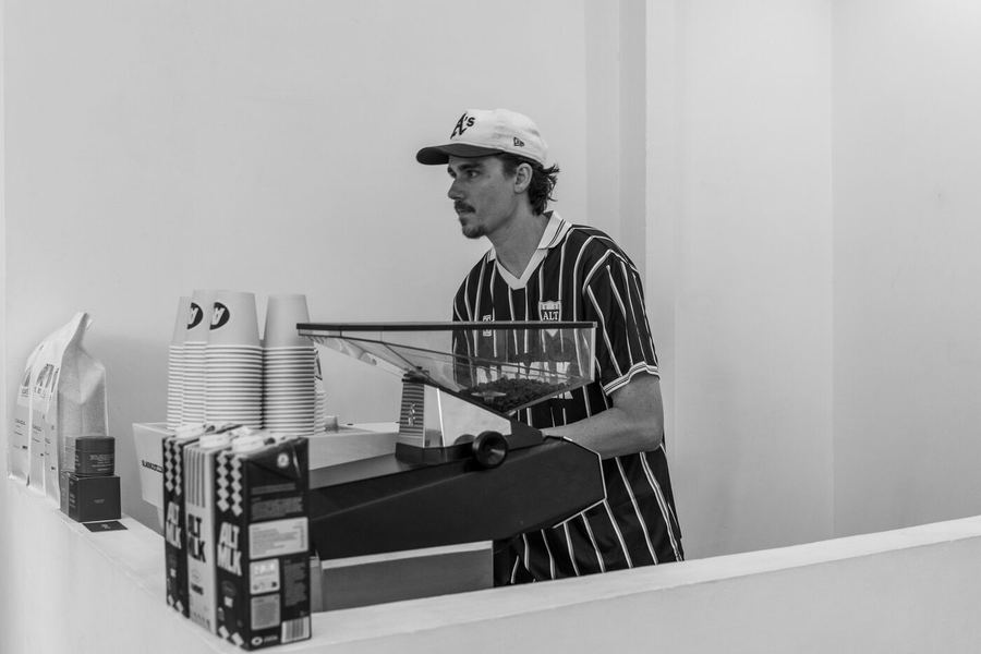 A buyer at the coffee counter, in black and white.
